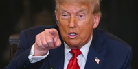 A taxação de 50% contra o Brasil, determinada por Trump, pode respingar em uma fonte importante de crescimento: os investimentos estrangeiros diretos  Foto: Jim Watson/AFP/Estadão
