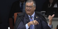 Ministro Flávio Dino durante o quinta dia de julgamento da trama golpista  Foto: Reprodução/TV Justiça