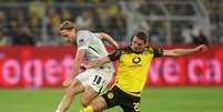 Dean Mouhtaropoulos/Getty Images - Legenda: Borussia Dortmund conquistou importante vitória em casa  Foto: Jogada10
