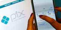 Na pr&aacute;tica, o avan&ccedil;o do Pix afeta principalmente empresas americanas como Visa e Mastercard, cujo modelo de neg&oacute;cios depende da cobran&ccedil;a de taxas sobre transa&ccedil;&otilde;es realizadas com cart&otilde;es de cr&eacute;dito e d&eacute;bito  Foto: Bruno Peres/Ag&ecirc;ncia Brasil / Estad&atilde;o
