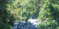 Corpos estavam na regi&atilde;o do Morro do Melado, no bairro Fundos, em Bigua&ccedil;u  Foto: NDTV/ Record
