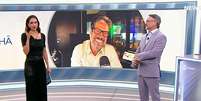 Phelipe Siani na primeira intera&ccedil;&atilde;o com os &acirc;ncoras L&iacute;via Zanolini e L&uacute;cio Sturm no SBT News  Foto: Reprodu&ccedil;&atilde;o/TV