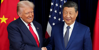 Donald Trump ao lado de Xi Jinping  Foto: Andrew Harnik/Getty Images