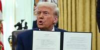 Donald Trump aplica novas tarifas de 25% contra o Brasil  Foto: AFP