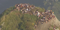 Turistas ilhados no Morro do Vidigal ficam presos durante quase 4 horas  Foto: Reprodução/Globonews