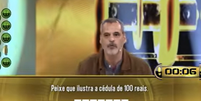 Bruno Garcia não conseguiu responder a uma pergunta sobre o peixe que ilustra a cédula de R$ 100 e perdeu R$ 150 mil no programa Acerte ou Caia!  Foto: Reprodução/Record