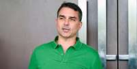 Men&ccedil;&otilde;es negativas a Fl&aacute;vio Bolsonaro nas redes sociais aumentaram ap&oacute;s epis&oacute;dio envolvendo Daniel Vorcaro; n&iacute;vel de confian&ccedil;a tamb&eacute;m caiu  Foto: Getty Images / BBC News Brasil