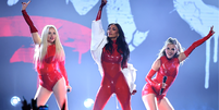 Kimberly Wyatt, Nicole Scherzinger e Ashley Roberts, das The Pussycat Dolls, se apresentam no AMAs  Foto: Ethan Miller/Getty Images