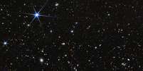 O Universo &eacute; vasto e repleto de estrelas, mas, se existe vida extraterrestre inteligente, talvez ela n&atilde;o consiga visitar a Terra devido a obst&aacute;culos f&iacute;sicos e de engenharia para viagens interestelares. NASA, ESA, CSA, STScI, Rohan Naidu (MIT); Image Processing: Joseph DePasquale (STScI), CC BY  Foto: The Conversation