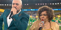 Falha em execu&ccedil;&atilde;o do Hino Nacional por Belo e Alcione em jogo do Brasil viraliza: 'Gostaram?'  Foto: Reprodu&ccedil;&atilde;o/GE TV