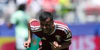 Boualem Khoukhi comemora ap&oacute;s marcar o primeiro gol do Catar na Copa.  Foto: Emilee Chinn/Getty Images