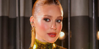 Sinto muito, Converse, mas encontrei na Renner um t&ecirc;nis feminino na cor 'dourado Cle&oacute;patra' para iluminar o look no inverno. Foto: Brazilnews, Manuela Scarpa / Purepeople
