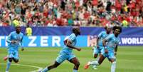 Yoane Wissa comemorando o primeiro gol do Congo na hist&oacute;ria das Copas do Mundo.  Foto: FIFA/ Getty Images