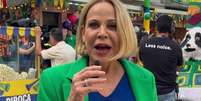 Claudete Troiano caprichou no figurino com as cores da bandeira brasileira para participar do 'Caldeir&atilde;o'  Foto: Reprodu&ccedil;&atilde;o