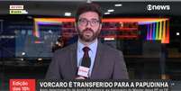 O Palácio do Planalto com as cores da bandeira LGBT+ ao fundo da entrada ao vivo do repórter Filipe Matoso  Foto: Reprodução/TV