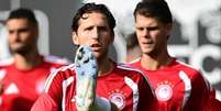 Foto: Divulga&ccedil;&atilde;o - Legenda: Jogadores do Olympiacos durante treinamento da equipe / Jogada10