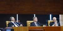 Flavio Dino, Andre Mendon&ccedil;a e Alexandre de Moraes no STF  Foto: Luiz Silveira/STF