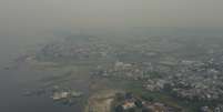 A cidade de Manaus coberta por uma densa camada de fuma&ccedil;a em decorr&ecirc;ncia das queimadas na regi&atilde;o da Amaz&ocirc;nia brasileira, fazendo com que a qualidade do ar seja classificada como pessima segundo dados do IQAir.  Foto: SUAMY BEYDOUN/AGIF - AG&Ecirc;NCIA DE FOTOGRAFIA/ESTAD&Atilde;O CONTE&Uacute;DO