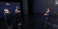 Fl&aacute;vio Bolsonaro (PL) e Lula (PT) se enfrentam no debate da Band neste domingo, 18  Foto: Reprodu&ccedil;&atilde;o/Band TV