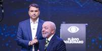 Lula e Flávio Bolsonaro durante debate da Band  Foto: BRUNO MOTTA/ENQUADRAR / Estadão