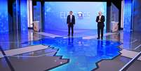 Fl&aacute;vio Bolsonaro e Lula no debate da Globo  Foto:  Buda Mendes / Getty Images