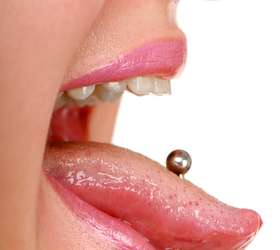 Qual é o risco de ter piercing na boca? ~ Dentopolis