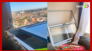Ciclone: mulher mostra janela de apartamento que teria sido arrancada por ventania em São Paulo