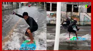 Homem surfa em ruas alagadas de Salvador e provoca prefeito