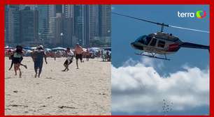 Helicóptero faz 'chover' dinheiro em praia de Santa Catarina