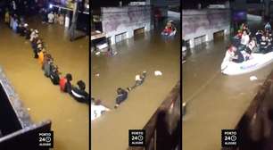 Vídeo impressionante! Comunidade forma cordão humano para salvar vidas em meio a inundações