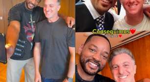 Will Smith derruba celular de Luciano Huck ao recriar foto e diz que vai comprar um novo; veja vídeo