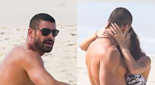 Assumiu? Cauã Reymond é flagrado aos beijos em praia do Rio; veja com quem