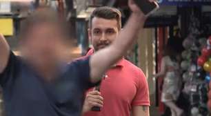 Repórter se irrita com homem que atrapalha a gravação de matéria na rua