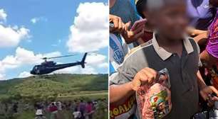 Frigorífico joga carnes com Flávio Bolsonaro por helicóptero em ação de Natal e gera polêmica
