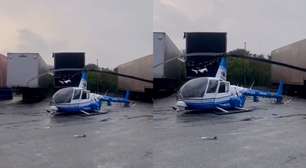 Helicóptero da Band faz pouso forçado em São Paulo e atinge carreta