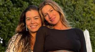 Gisele Bündchen aparece com barrigão pintado em foto inédita divulgada por parteira