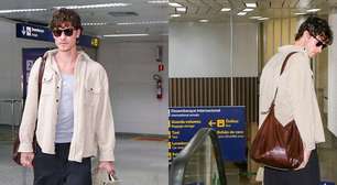 Carnaval no Rio com Bruna Marquezine? Após temporada da atriz nos EUA, Shawn Mendes desembarca com look neutro e bolsa de couro marrom