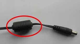 Aquele "cilindro" no cabo do seu notebook não está ali de enfeite: o "escudo invisível" que salva a vida do seu computador todos os dias