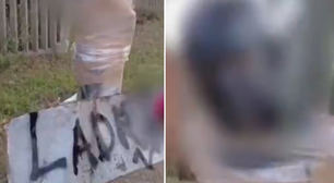 Polícia prende moradores que amarraram homem em poste com placa de 'ladrão'