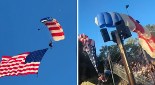 Veja momento em que paraquedista com bandeira gigante dos EUA cai sobre tenda
