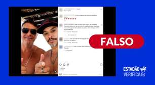 É falso que foto de Flávio Bolsonaro com caminhoneiro tenha sido adulterada para inserir Sicário