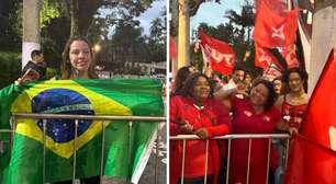 Separados por grades e provocações: bolsonaristas e petistas marcam presença em 1º debate entre Flávio e Lula