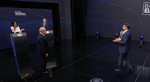 Apresentadora dá bronca em Flávio Bolsonaro e Lula durante debate: 'Vamos respeitar'