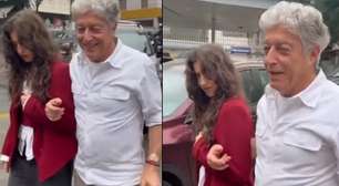 De bengala, Caco Barcellos vota acompanhado da filha após cirurgia na coluna