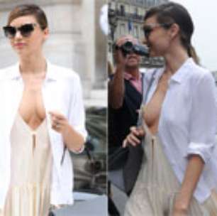 Miranda Kerr quase mostra demais com vestido decotado em Paris