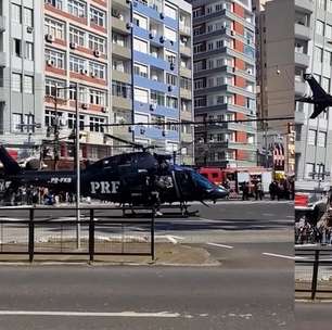 Helicóptero pousa no meio de avenida e impressiona moradores em Porto Alegre