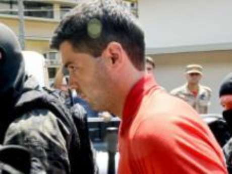 Tiago Henrique Gomes da Rocha é escoltado pela polícia <p>Tiago Henrique Gomes da Rocha é escoltado pela polícia</p>