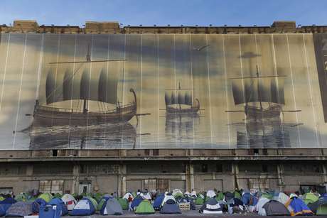 stores where they sleep migrants, placed in  the Athens port of Piraeus, on Thursday, April 7,  2016 ..