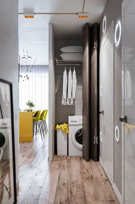 11. A área da lavanderia recebeu o acabamento com piso flutuante. Fonte: Pinterest 11. A área da lavanderia recebeu o acabamento com piso flutuante. Fonte: Pinterest