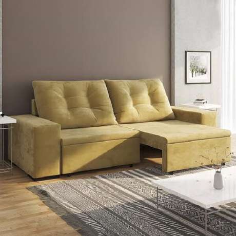 4. Modelo de sofá retrátil amarelo para sala de estar. Fonte: Pinterest 4. Modelo de sofá retrátil amarelo para sala de estar. Fonte: Pinterest
